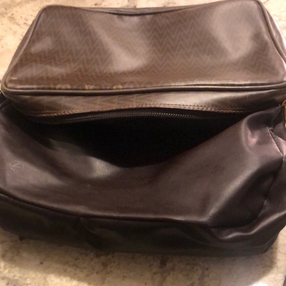 Mario Valentino Crossbody Bag
Mario Valentino
Size: 11 × 8 × 3.5 - Picture 8 of 11